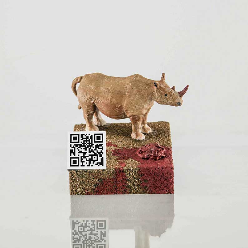 Ima u enciklopediji - 3D ilustracija 3D ilustracija na kojoj je posljednji nosorog s QR kodom